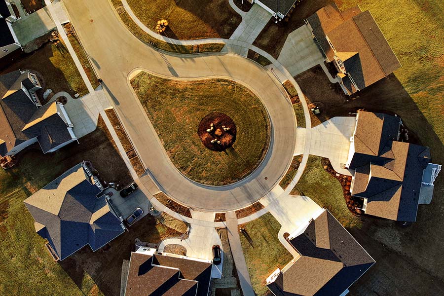 HOA Certificate of Insurance - Aerial View Looking Down at a Quiet Cul-de-sac Neighborhood with Large Luxury Homes at Sunset